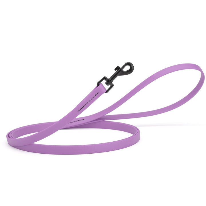 Purple dog leash with a black clip on a white background