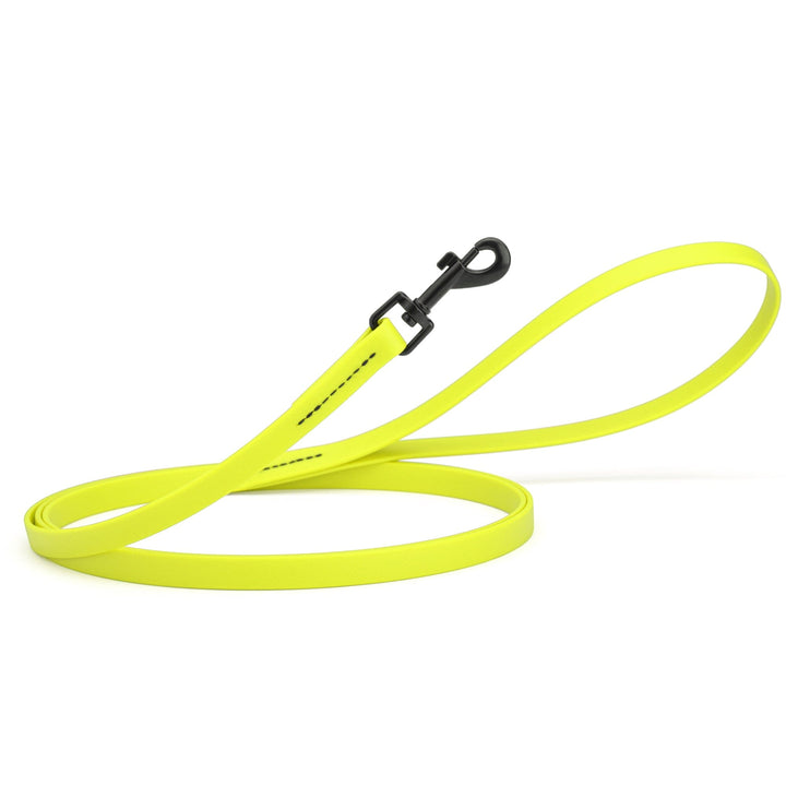 Neon yellow dog leash with a black clip on a white background