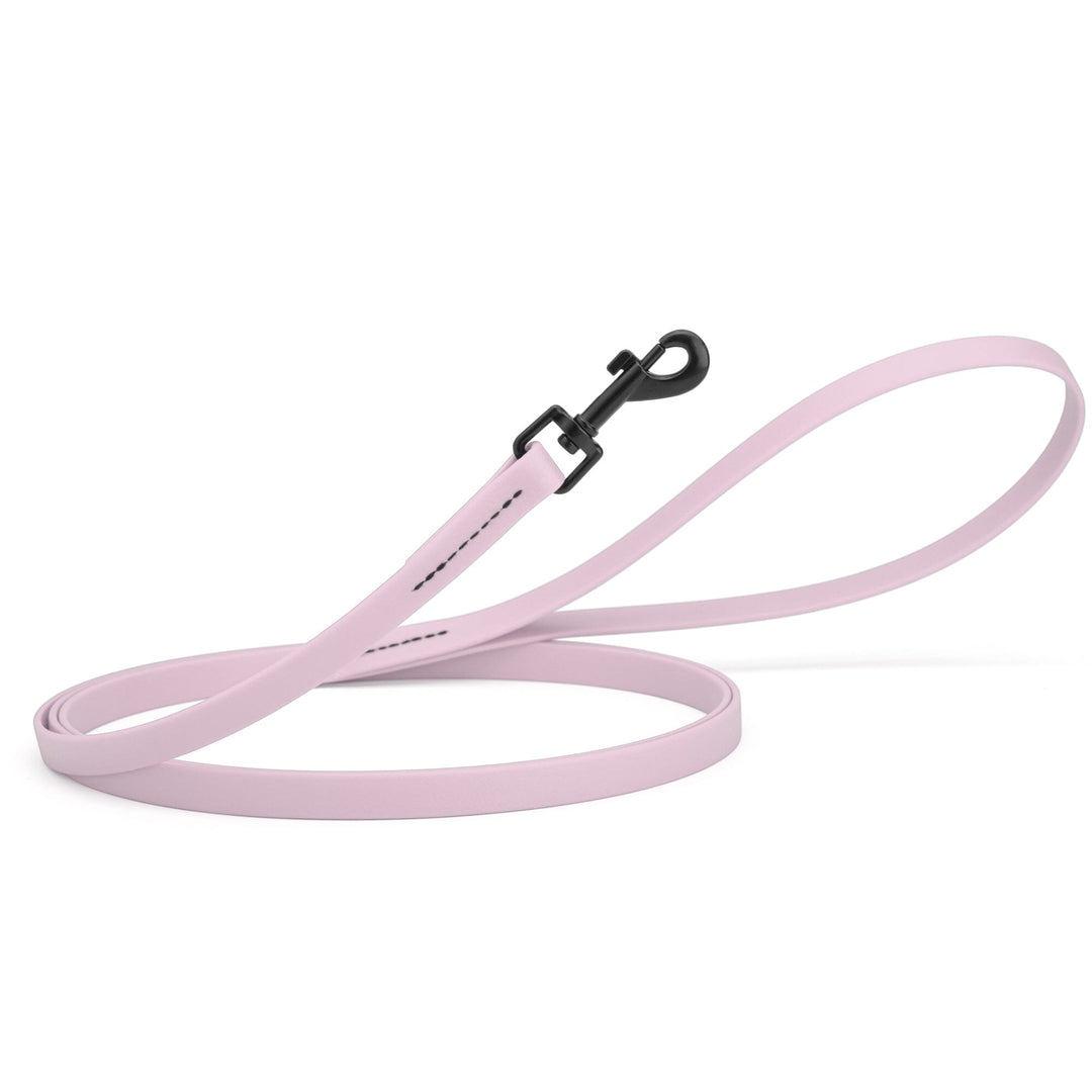 Light pink dog leash with a black clip on a white background