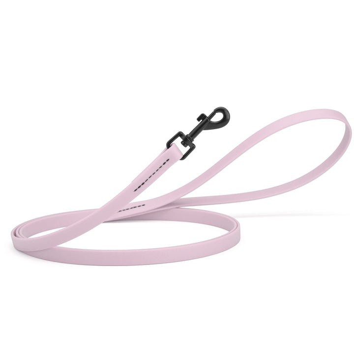 Light pink dog leash with a black clip on a white background