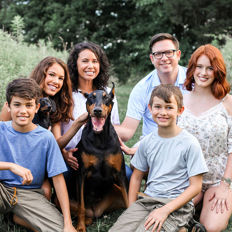 The inventor of BravoWalk posed with his wife, children, and pet dogs.