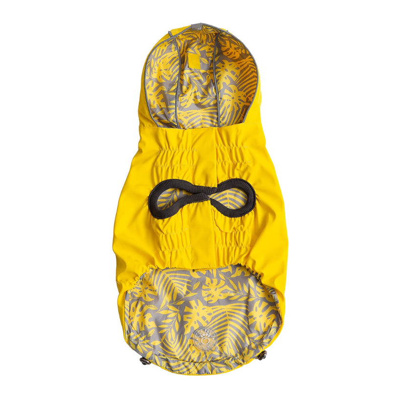 Yellow dog raincoat with jungle florals pattern on a white background