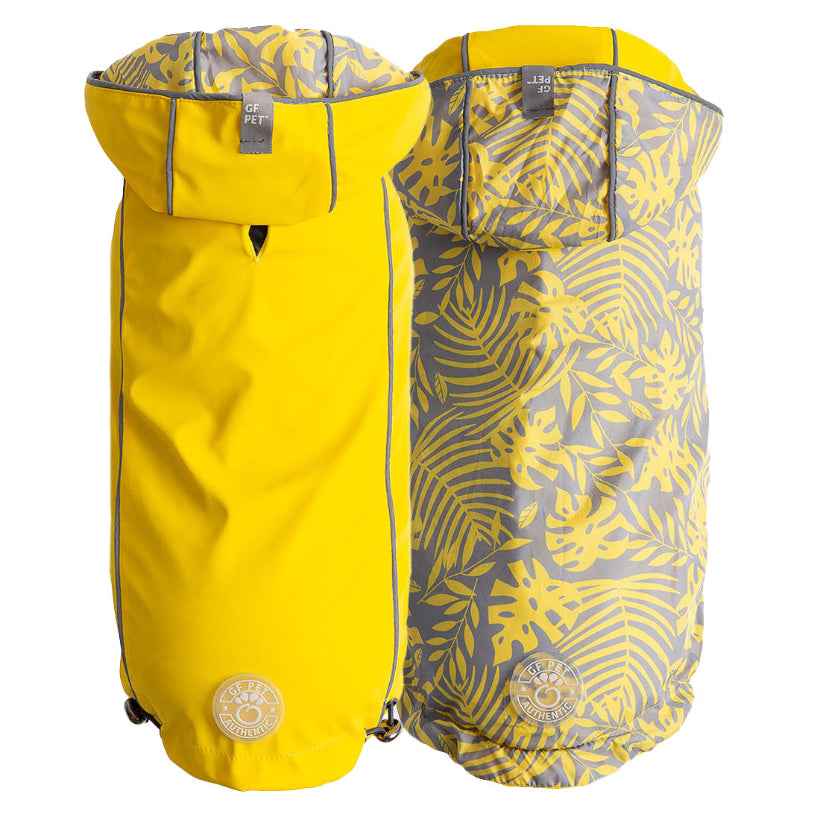 dog waterproof raincoat, one side yellow and one side jungle leaf pattern, on a white background.